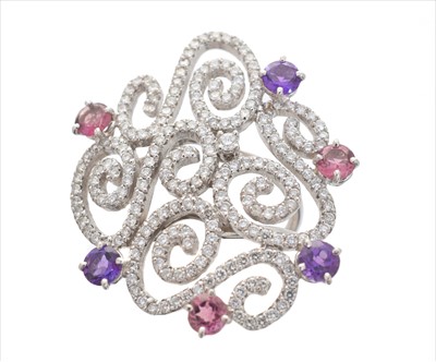 Lot 301 - An amethyst, tourmaline and diamond dress ring by Casato