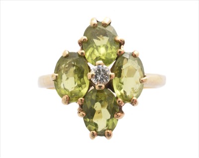 Lot 226 - A 9ct gold peridot and diamond dress ring