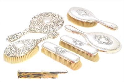 Lot 70 - Two silver dressing table sets