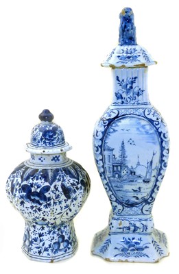 Lot 287 - Delft square section lidded vase with lion finial, also another octagonal vase.