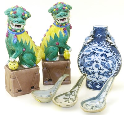 Lot 136 - Pair of Chinese Dogs of Foo, a moon flask and three rice spoons.