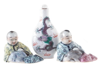 Lot 129 - Pair of Chinese porcelain figures and a snuff bottle