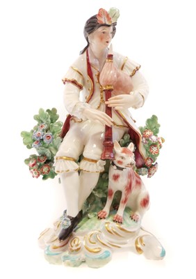 Lot 150 - Derby figure of a boy with bagpipes