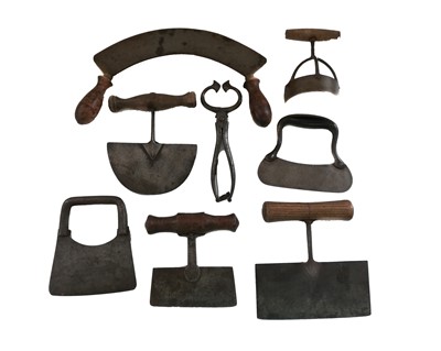 Lot 57 - A group of kitchen chopping board blades and a pair of toffee cutters.