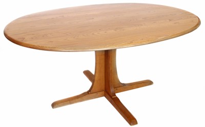 Lot 148 - Ercol ash and elm oval dining table.