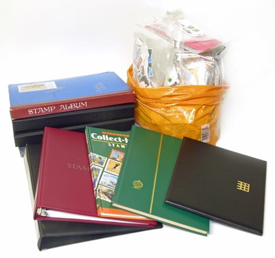 Lot 74 - All World stamp collection in carton of 8 albums (one of USA) and large bag of loose and in packets.