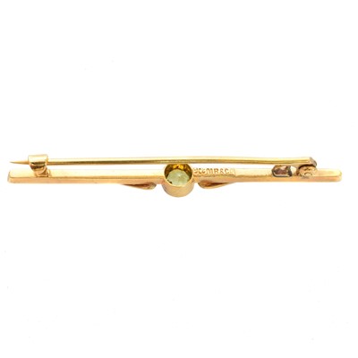 Lot 28 - An early 20th century peridot and split pearl brooch by Murrle Bennett & Co.