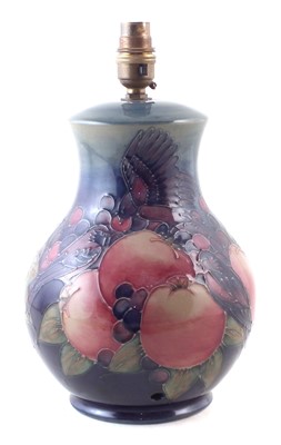 Lot 154 - Moorcroft birds pecking fruit lampbase