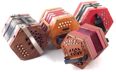 Lot 48 - Four Concertinas, one with case.