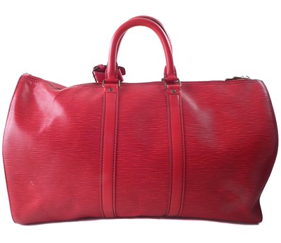 Lot 57 - A Louis Vuitton red Epi Keepall 45 luggage bag