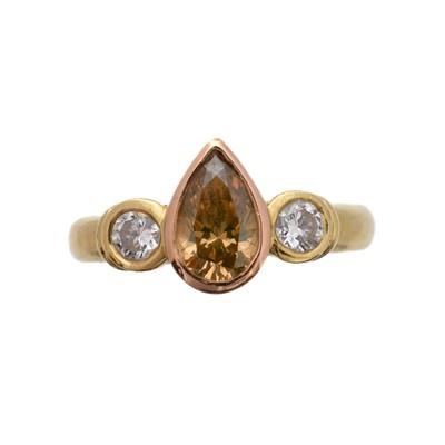 Lot 162 - A 'brown' diamond and diamond three stone ring