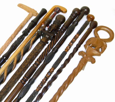 Lot 294 - Ten modern hardwood walking sticks of varying designs and woods.