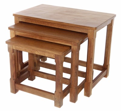 Lot 145 - A nest of three Robert "Mouseman" Thompson oak tables.