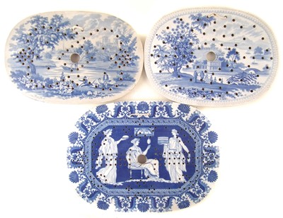 Lot 265 - Three blue transfer printed strainers
