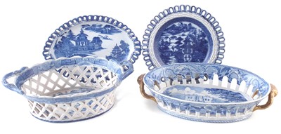 Lot 259 - Two pierced blue transfer baskets and two stands