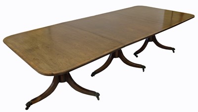 Lot 363 - A George III style mahogany three-pillar dining table