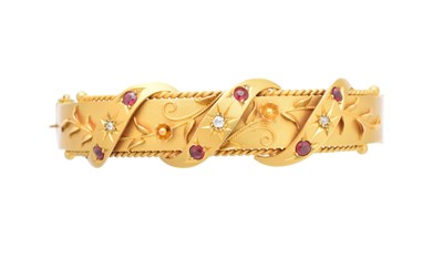 Lot 2 - A 9ct gold hinged bangle