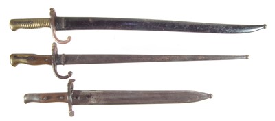 Lot 394 - Three bayonets and scabbards