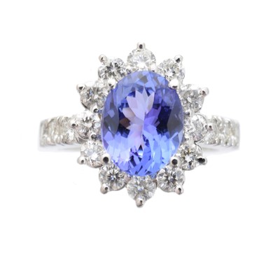 Lot 222 - A tanzanite and diamond cluster ring