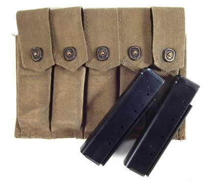 Lot 174 - Thompson machine gun magazine pouch and two twenty round magazines.