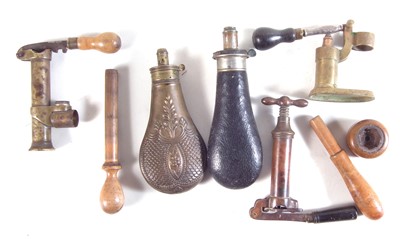 Lot 219 - Vintage shotgun reloading tools and two powder flasks.