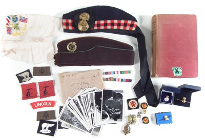 Lot 429 - Collection of military items including two caps, badges etc.