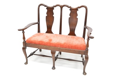Lot 387 - Late 19th-century oak double chair back settle