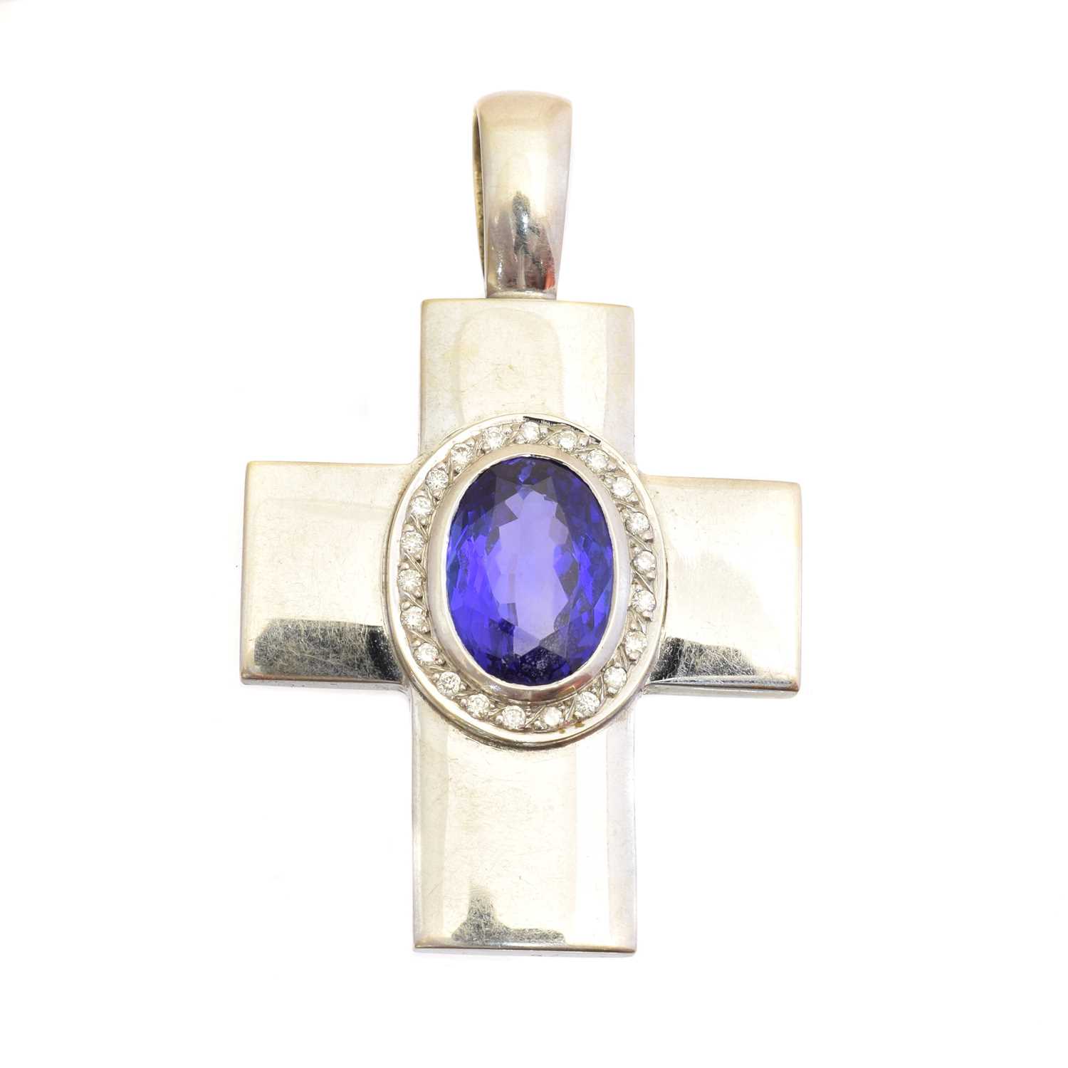 Lot 54 - A tanzanite and diamond cross pendant