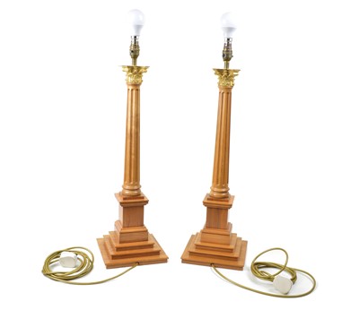 Lot 232 - A pair of David Linley walnut table lamps