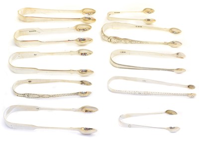 Lot 224 - A large selection of George III and later silver tongs