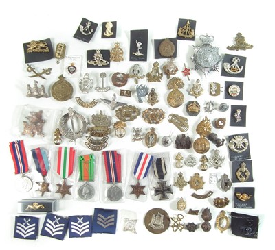 Lot 254 - Approximately seventy five Cap badges