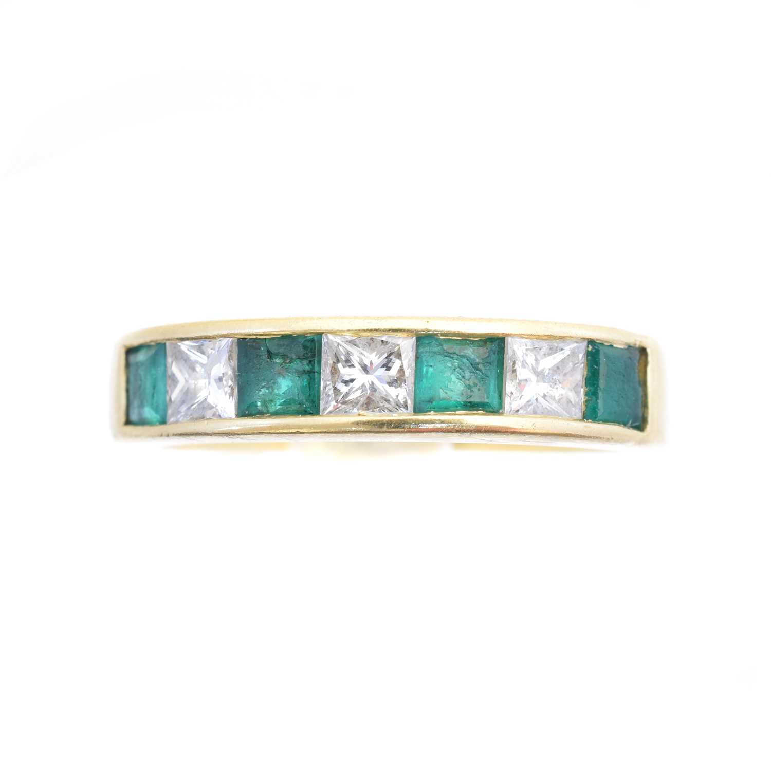 Lot 93 - An 18ct gold emerald and diamond band ring