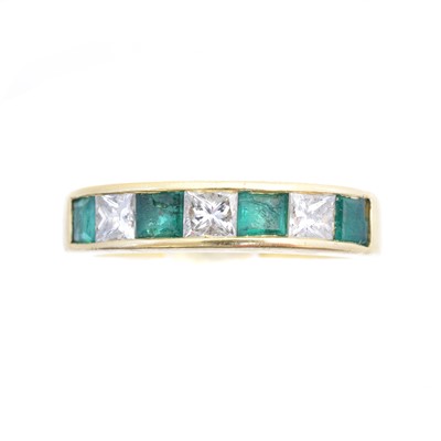 Lot 93 - An 18ct gold emerald and diamond band ring