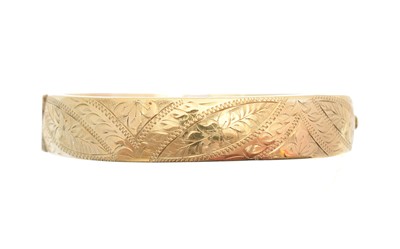 Lot 4 - A 9ct gold hinged bangle