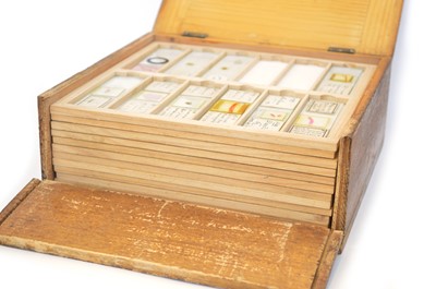 Lot 167 - Square pine box with hinged lid containing eleven trays of microscope slides