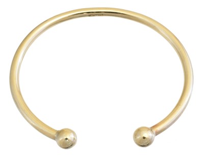 Lot 2 - A 9ct gold torque bangle