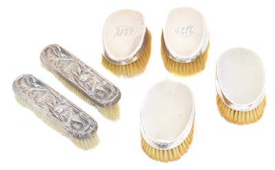 Lot 93 - Six silver backed brushes