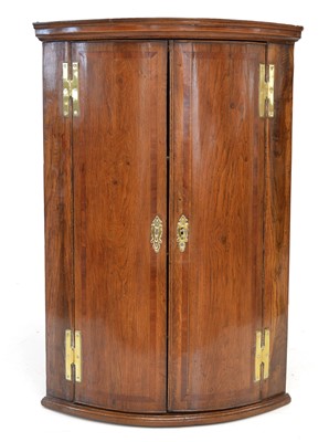 Lot 295 - George III corner cupboard.