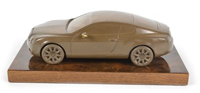 Lot 40 - bronzed resin desk ornament of a Bentley Continental GT on a lustrous wooden base
