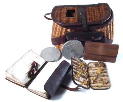 Lot 181 - Fine leather bound trout creel and contents