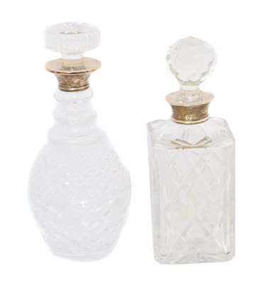 Lot 101 - Two silver topped decanters