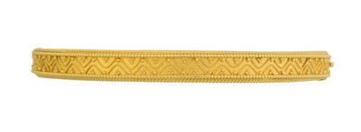 Lot 24 - A Victorian Etruscan Revival hinged bangle