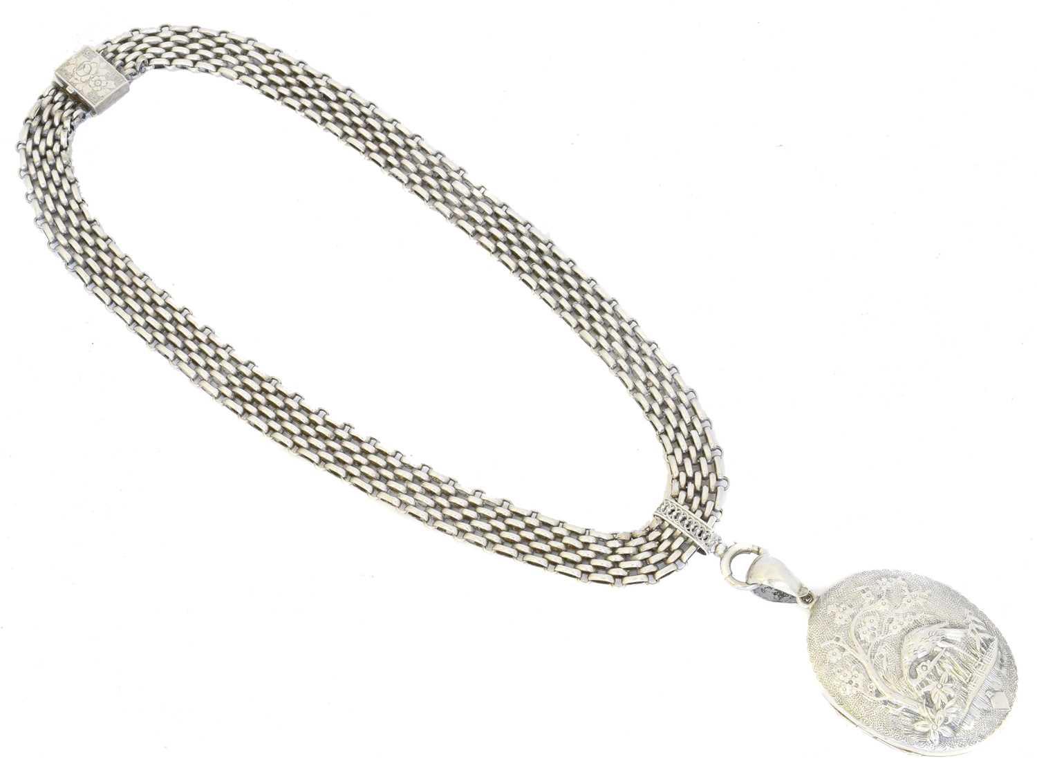 Lot 51 - A late Victorian Aesthetic white metal hinged locket