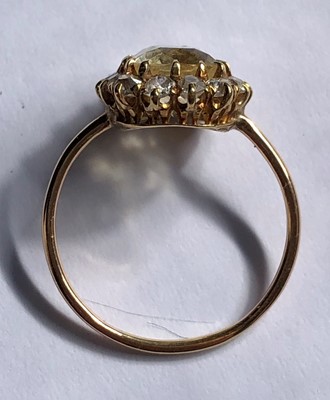 Lot 86 - A sapphire and diamond cluster ring