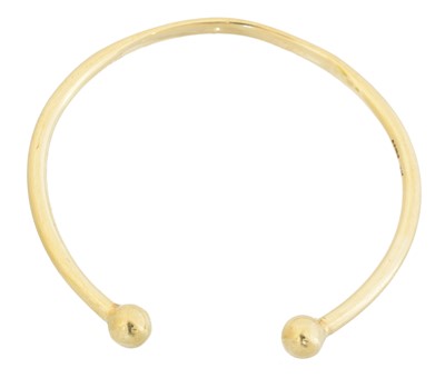 Lot 29 - A 9ct gold torque bangle