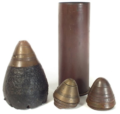 Lot 149 - Three WWI artillery fuses and a shell case