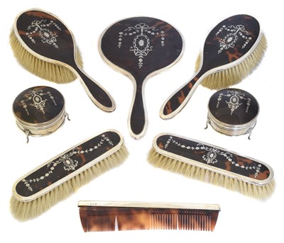 Lot 86 - A George V silver and tortoiseshell dressing set