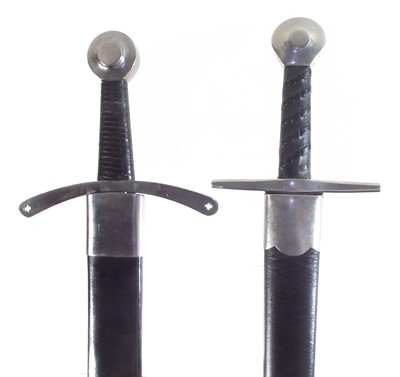 Lot 29 - Two modern replica swords and scabbards