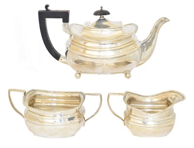 Lot 184 - A silver three piece teaset