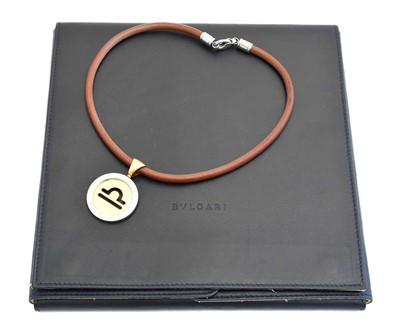 Lot 71 - An 18ct gold and stainless steel Zodiac Tondo necklace by Bulgari